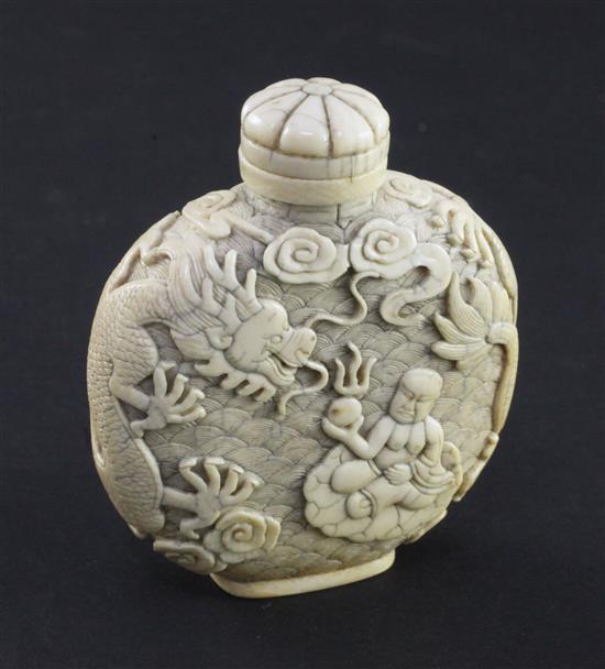 A Chinese ivory dragon and luohan snuff bottle, 1800-1850, 6.2cm